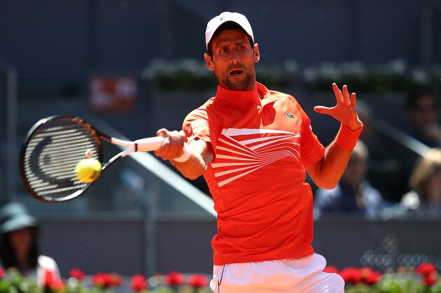MADRID, SPAIN - MAY 09:  Novak Djokovic of Serbia plays a forehand in his match against Jeremy Chardy of France during day six of the Mutua Madrid Open at La Caja Magica on May 09, 2019 in Madrid, Spain. (Photo by Julian Finney/Getty Images)