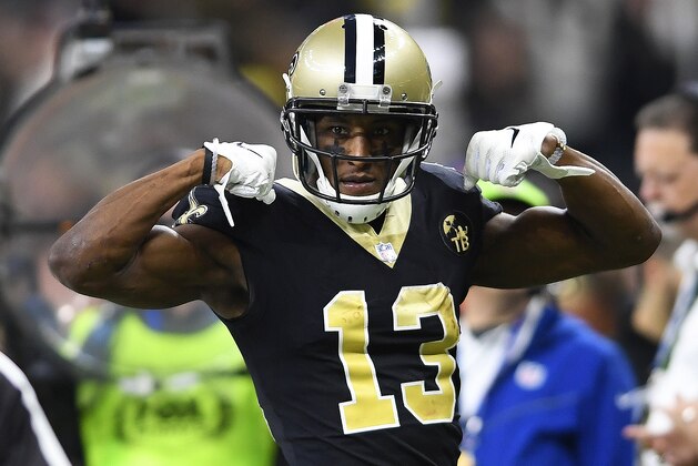 New Orleans Saints wide receiver Michael Thomas (13) celebrates a run against the Philadelphia Eagles in the first half of an NFL divisional playoff football game in New Orleans, Sunday, Jan. 13, 2019. (AP Photo/Bill Feig)