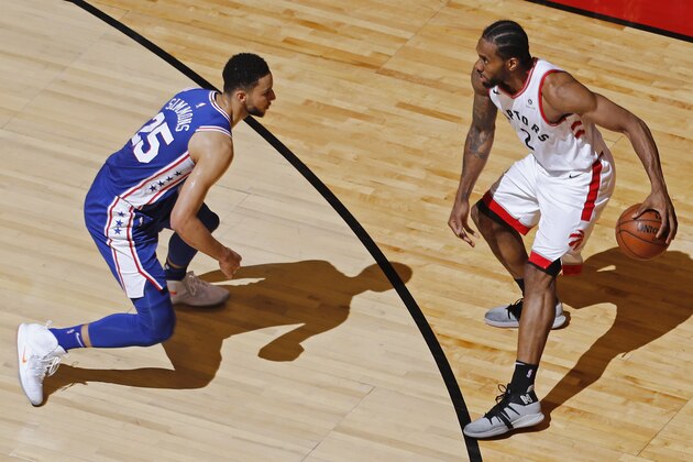 TORONTO, CANADA - MAY 7: Kawhi Leonard #2 of the Toronto Raptors handles the ball against Ben Simmons #25 of the Philadelphia 76ers during Game Five of the Eastern Conference SemiFinals of the 2019 NBA Playoffs on May 7, 2019 at the Scotiabank Arena in Toronto, Ontario, Canada.  NOTE TO USER: User expressly acknowledges and agrees that, by downloading and or using this Photograph, user is consenting to the terms and conditions of the Getty Images License Agreement.  Mandatory Copyright Notice: Copyright 2019 NBAE (Photo by Mark Blinch/NBAE via Getty Images)