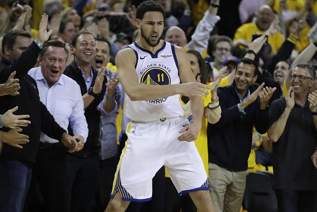 Golden State Warriors' Klay Thompson celebrates in front of fans during the second half of Game 5 of the team's second-round NBA basketball playoff series against the Houston Rockets on Wednesday, May 8, 2019, in Oakland, Calif. (AP Photo/Ben Margot)
