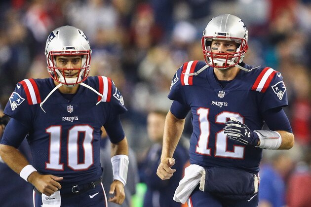 FOXBORO, MA - OCTOBER 22:  Tom Brady #12 and Jimmy Garoppolo #10 of the New England Patriots run onto the field before a game against the Atlanta Falcons at Gillette Stadium on October 22, 2017 in Foxboro, Massachusetts.  (Photo by Maddie Meyer/Getty Images)