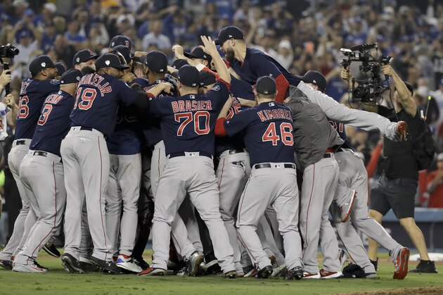 The Boston Red Sox celebrate after Game 5 of baseball's World Series against the Los Angeles Dodgers on Sunday, Oct. 28, 2018, in Los Angeles. The Red Sox won 5-1 to win the series 4 games to 1. (AP Photo/David J. Phillip)