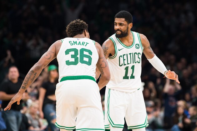 BOSTON, MA - MARCH 29: Kyrie Irving #11 and Marcus Smart #36 of the Boston Celtics celebrate during the game against the Indiana Pacers at TD Garden on March 29, 2019 in Boston, Massachusetts. NOTE TO USER: User expressly acknowledges and agrees that, by downloading and or using this photograph, User is consenting to the terms and conditions of the Getty Images License Agreement. (Photo by Kathryn Riley/Getty Images)
