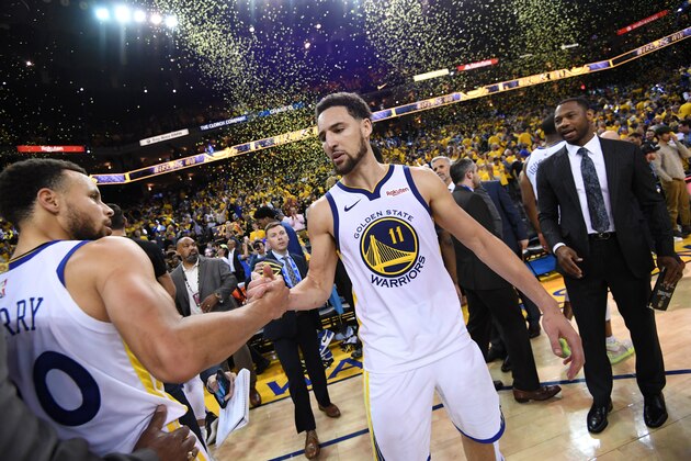 OAKLAND, CA - MAY 8:  Stephen Curry #30 shakes hands with Klay Thompson #11 of the Golden State Warriors after winning Game Five of the Western Conference Semifinals of the 2019 NBA Playoffs against the Houston Rockets on May 8, 2019 at ORACLE Arena in Oakland, California. NOTE TO USER: User expressly acknowledges and agrees that, by downloading and/or using this photograph, user is consenting to the terms and conditions of Getty Images License Agreement. Mandatory Copyright Notice: Copyright 2019 NBAE (Photo by Noah Graham/NBAE via Getty Images)
