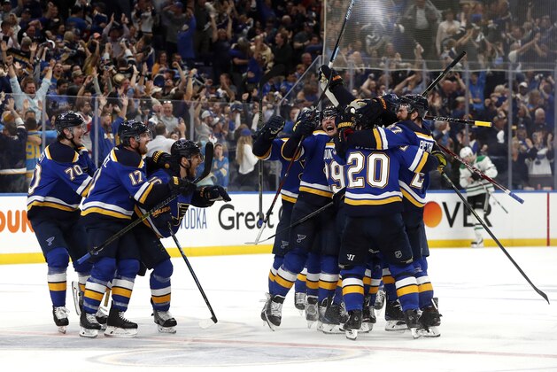 St. Louis Blues celebrate after defeating the Dallas Stars in double overtime in Game 7 of an NHL second-round hockey playoff series Tuesday, May 7, 2019, in St. Louis. The Blues won 2-1. (AP Photo/Jeff Roberson)