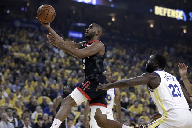 Houston Rockets' Chris Paul, left, lays up a shot past Golden State Warriors' Draymond Green (23) during the first half of Game 5 of a second-round NBA basketball playoff series Wednesday, May 8, 2019, in Oakland, Calif. (AP Photo/Ben Margot)
