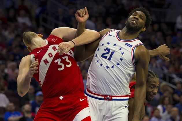 PHILADELPHIA, PA - MAY 09: Joel Embiid #21 of the Philadelphia 76ers commits a flagrant 1 foul on Marc Gasol #33 of the Toronto Raptors in the fourth quarter of Game Six of the Eastern Conference Semifinals at the Wells Fargo Center on May 9, 2019 in Philadelphia, Pennsylvania. The 76ers defeated the Raptors 112-101. NOTE TO USER: User expressly acknowledges and agrees that, by downloading and or using this photograph, User is consenting to the terms and conditions of the Getty Images License Agreement. (Photo by Mitchell Leff/Getty Images)