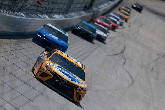 DOVER, DE - MAY 06:  Kyle Busch, driver of the #18 Pedigree Toyota, leads a pack of cars during the Monster Energy NASCAR Cup Series Gander RV 400 at Dover International Speedway on May 6, 2019 in Dover, Delaware.  (Photo by Sean Gardner/Getty Images)