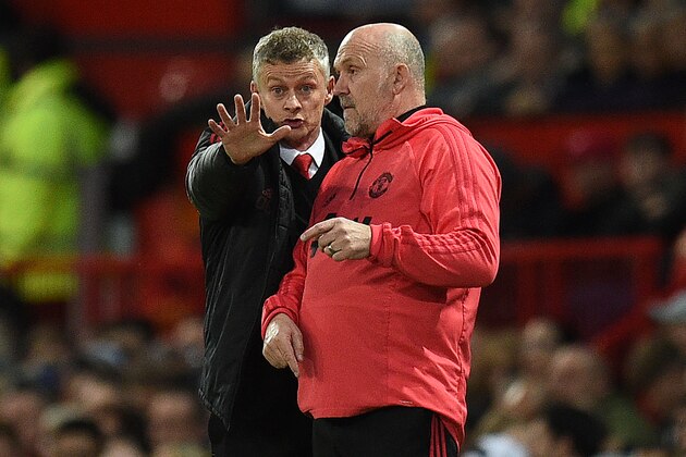 Manchester United's Norwegian manager Ole Gunnar Solskjaer (L) and Manchester United's English first-team coach Mike Phelan shouts instructions to his players from the touchline during the English Premier League football match between Manchester United and Manchester City at Old Trafford in Manchester, north west England, on April 24, 2019. (Photo by Oli SCARFF / AFP) / RESTRICTED TO EDITORIAL USE. No use with unauthorized audio, video, data, fixture lists, club/league logos or 'live' services. Online in-match use limited to 120 images. An additional 40 images may be used in extra time. No video emulation. Social media in-match use limited to 120 images. An additional 40 images may be used in extra time. No use in betting publications, games or single club/league/player publications. /         (Photo credit should read OLI SCARFF/AFP/Getty Images)