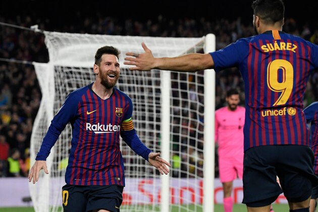 Barcelona's Argentinian forward Lionel Messi celebrates with Barcelona's Uruguayan forward Luis Suarez (R) after scoring a goal during the UEFA Champions League semi-final first leg football match between Barcelona and Liverpool at the Camp Nou Stadium in Barcelona on May 1, 2019. (Photo by LLUIS GENE / AFP)        (Photo credit should read LLUIS GENE/AFP/Getty Images)