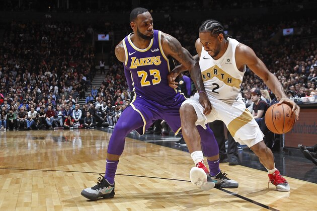 TORONTO, CANADA - MARCH 14: Kawhi Leonard #2 of the Toronto Raptors handles the ball against LeBron James #23 of the Los Angeles Lakers on March 14, 2019 at the Scotiabank Arena in Toronto, Ontario, Canada.  NOTE TO USER: User expressly acknowledges and agrees that, by downloading and or using this Photograph, user is consenting to the terms and conditions of the Getty Images License Agreement.  Mandatory Copyright Notice: Copyright 2019 NBAE (Photo by Mark Blinch/NBAE via Getty Images)