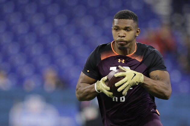 Memphis running back Tony Pollard runs a drill during the NFL football scouting combine, Friday, March 1, 2019, in Indianapolis. (AP Photo/Darron Cummings)