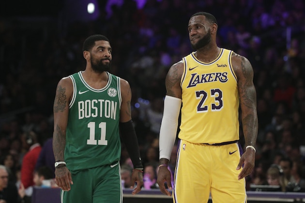 Los Angeles Lakers' LeBron James, right, and Boston Celtics' Kyrie Irving chat during the first half of an NBA basketball game, Saturday, March 9, 2019, in Los Angeles. (AP Photo/Jae C. Hong)