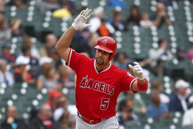 Los Angeles Angels' Albert Pujols tosses his bat after hitting a solo home run in the third inning of a baseball game against the Detroit Tigers in Detroit, Thursday, May 9, 2019. The home run was his 2,000th career RBI.  (AP Photo/Paul Sancya)
