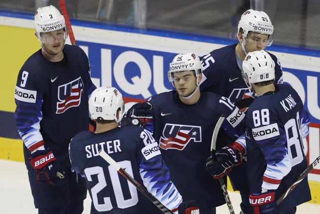 Alex Debrincat of the US, center, celebrates with teammates after scoring his sides first goal during the Ice Hockey World Championships group A match between the United States and France at the Steel Arena in Kosice, Slovakia, Sunday, May 12, 2019. (AP Photo/Petr David Josek)