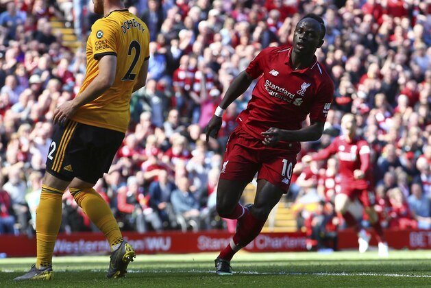 Liverpool's Sadio Mane, right, celebrates after scoring his side's opening goal during the English Premier League soccer match between Liverpool and Wolverhampton Wanderers at the Anfield stadium in Liverpool, England, Sunday, May 12, 2019. (AP Photo/Dave Thompson)