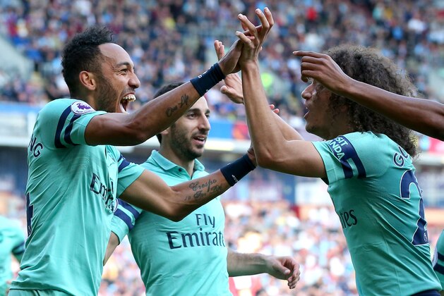 BURNLEY, ENGLAND - MAY 12: Pierre-Emerick Aubameyang of Arsenal celebrates with teammates after scoring his team's second goal during the Premier League match between Burnley FC and Arsenal FC at Turf Moor on May 12, 2019 in Burnley, United Kingdom. (Photo by Alex Livesey/Getty Images)