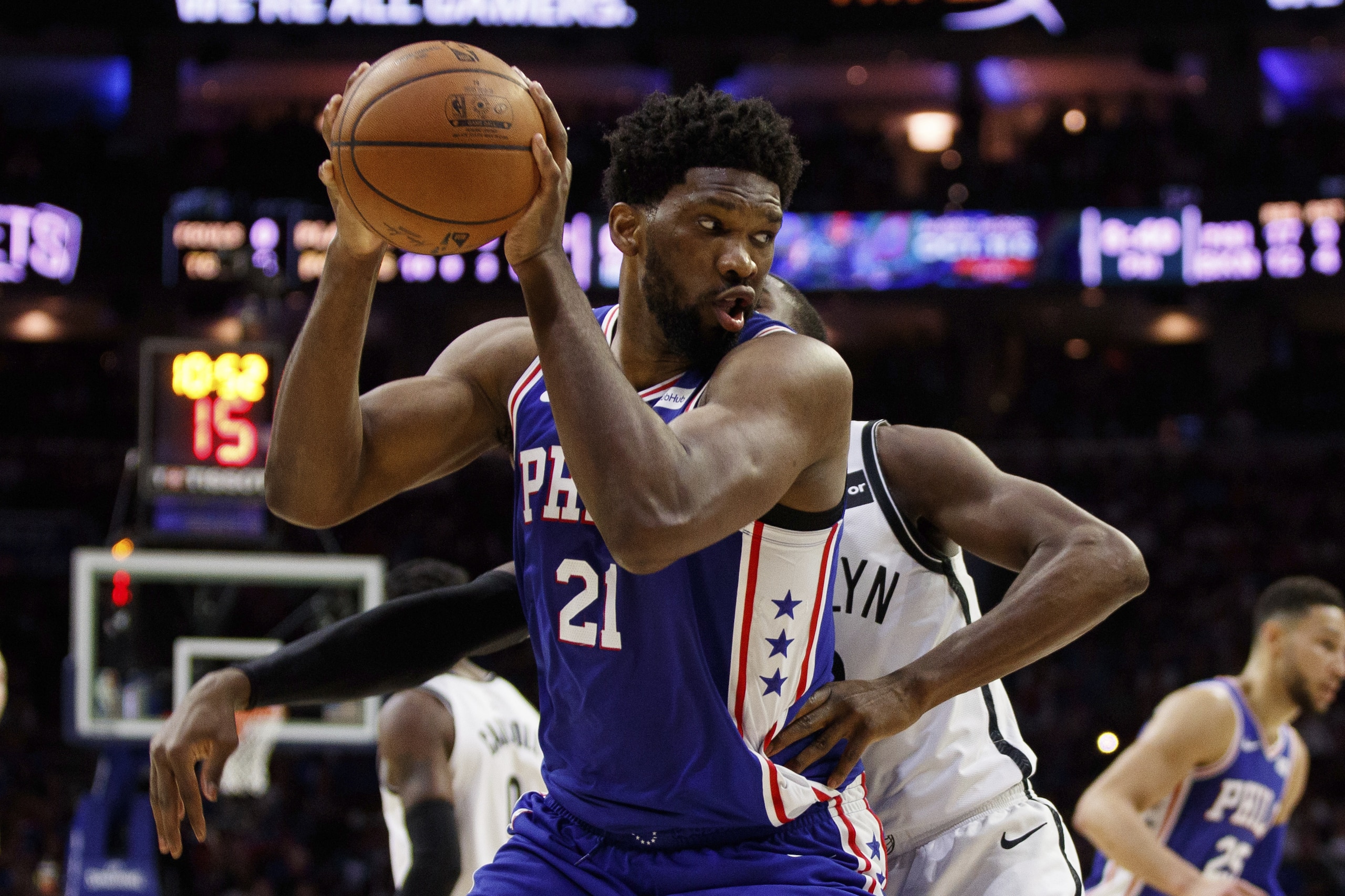 Philadelphia 76ers' Joel Embiid, left, of Cameroon, in action against Brooklyn Nets' Caris LeVert, right, during the first half in Game 5 of a first-round NBA basketball playoff series, Tuesday, April 23, 2019, in Philadelphia. The 76ers won 122-100. (AP Photo/Chris Szagola) Philadelphia 76ers' Joel Embiid, left, of Cameroon, in action against Brooklyn Nets' Caris LeVert, right, during the first half in Game 5 of a first-round NBA basketball playoff series, Tuesday, April 23, 2019, in Philadelphia. The 76ers won 122-100. (AP Photo/Chris Szagola)