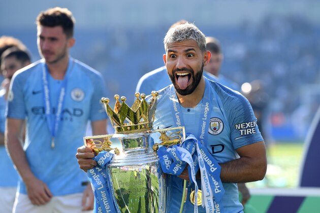 BRIGHTON, ENGLAND - MAY 12: Sergio Aguero of Manchester City  celebrates with the Premier League Trophy after winning the title following the Premier League match between Brighton & Hove Albion and Manchester City at American Express Community Stadium on May 12, 2019 in Brighton, United Kingdom. (Photo by Mike Hewitt/Getty Images)