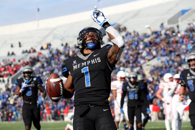 MEMPHIS, TN - NOVEMBER 23: Tony Pollard #1 of the Memphis Tigers celebrates a touchdown during the second half on November 23, 2018 at Liberty Bowl Memorial Stadium in Memphis, Tennessee. Memphis defeated Houston 52-31 to win the AAC West Division. (Photo by Joe Murphy/Getty Images)