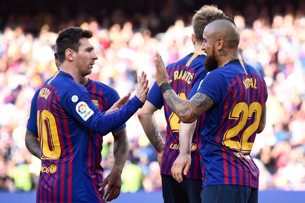 Barcelona's Chilean midfielder Arturo Vidal celebrates with Barcelona's Argentinian forward Lionel Messi (L) after scoring a goal during the Spanish League football match between Barcelona and Getafe at the Camp Nou Stadium in Barcelona on May 12, 2019. (Photo by Josep LAGO / AFP)        (Photo credit should read JOSEP LAGO/AFP/Getty Images)