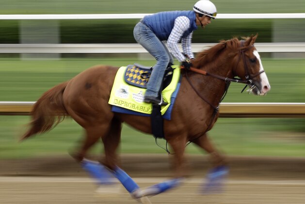 Kentucky Derby entrant Improbable runs during a workout at Churchill Downs Thursday, May 2, 2019, in Louisville, Ky. The 145th running of the Kentucky Derby is scheduled for Saturday, May 4. (AP Photo/Charlie Riedel)