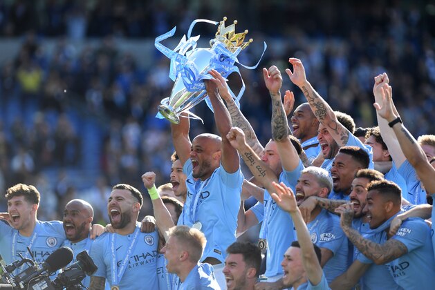 BRIGHTON, ENGLAND - MAY 12:   Manchester City captain Vincent Kompany lifts the Premier League Trophy after the Premier League match between Brighton & Hove Albion and Manchester City at American Express Community Stadium on May 12, 2019 in Brighton, United Kingdom. (Photo by Shaun Botterill/Getty Images)