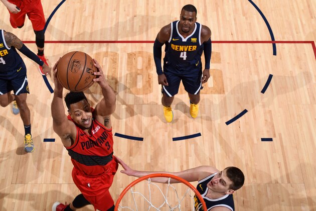 DENVER, CO - MAY 12:  CJ McCollum #3 of the Portland Trail Blazers goes to the basket against the Denver Nuggets during Game Seven of the Western Conference Semi-Finals of the 2019 NBA Playoffs on May 12, 2019 at the Pepsi Center in Denver, Colorado. NOTE TO USER: User expressly acknowledges and agrees that, by downloading and/or using this Photograph, user is consenting to the terms and conditions of the Getty Images License Agreement. Mandatory Copyright Notice: Copyright 2019 NBAE (Photo by Garrett Ellwood/NBAE via Getty Images)
