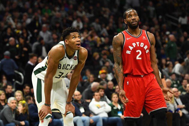 MILWAUKEE, WISCONSIN - JANUARY 05:  Giannis Antetokounmpo #34 of the Milwaukee Bucks and Kawhi Leonard #2 of the Toronto Raptors wait for a free throw during a game at Fiserv Forum on January 05, 2019 in Milwaukee, Wisconsin.  NOTE TO USER: User expressly acknowledges and agrees that, by downloading and or using this photograph, User is consenting to the terms and conditions of the Getty Images License Agreement. (Photo by Stacy Revere/Getty Images)