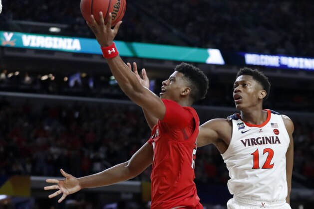 Texas Tech's Jarrett Culver (23) takes a shot against Virginia's De'Andre Hunter (12) during the second half in the championship of the Final Four NCAA college basketball tournament, Monday, April 8, 2019, in Minneapolis. (AP Photo/Jeff Roberson)