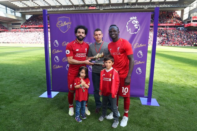 LIVERPOOL, ENGLAND - MAY 12: Mohamed Salah of Liverpool and Sadio Mane of Liverpool pose with the golden boot trophy after the Premier League match between Liverpool FC and Wolverhampton Wanderers at Anfield on May 12, 2019 in Liverpool, United Kingdom. (Photo by Catherine Ivill/Getty Images)