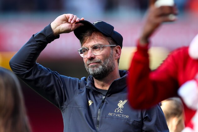 LIVERPOOL, ENGLAND - MAY 12: Jurgen Klopp manager / head coach of Liverpool doffs his cap to the fans during the Premier League match between Liverpool FC and Wolverhampton Wanderers at Anfield on May 12, 2019 in Liverpool, United Kingdom. (Photo by Robbie Jay Barratt - AMA/Getty Images)