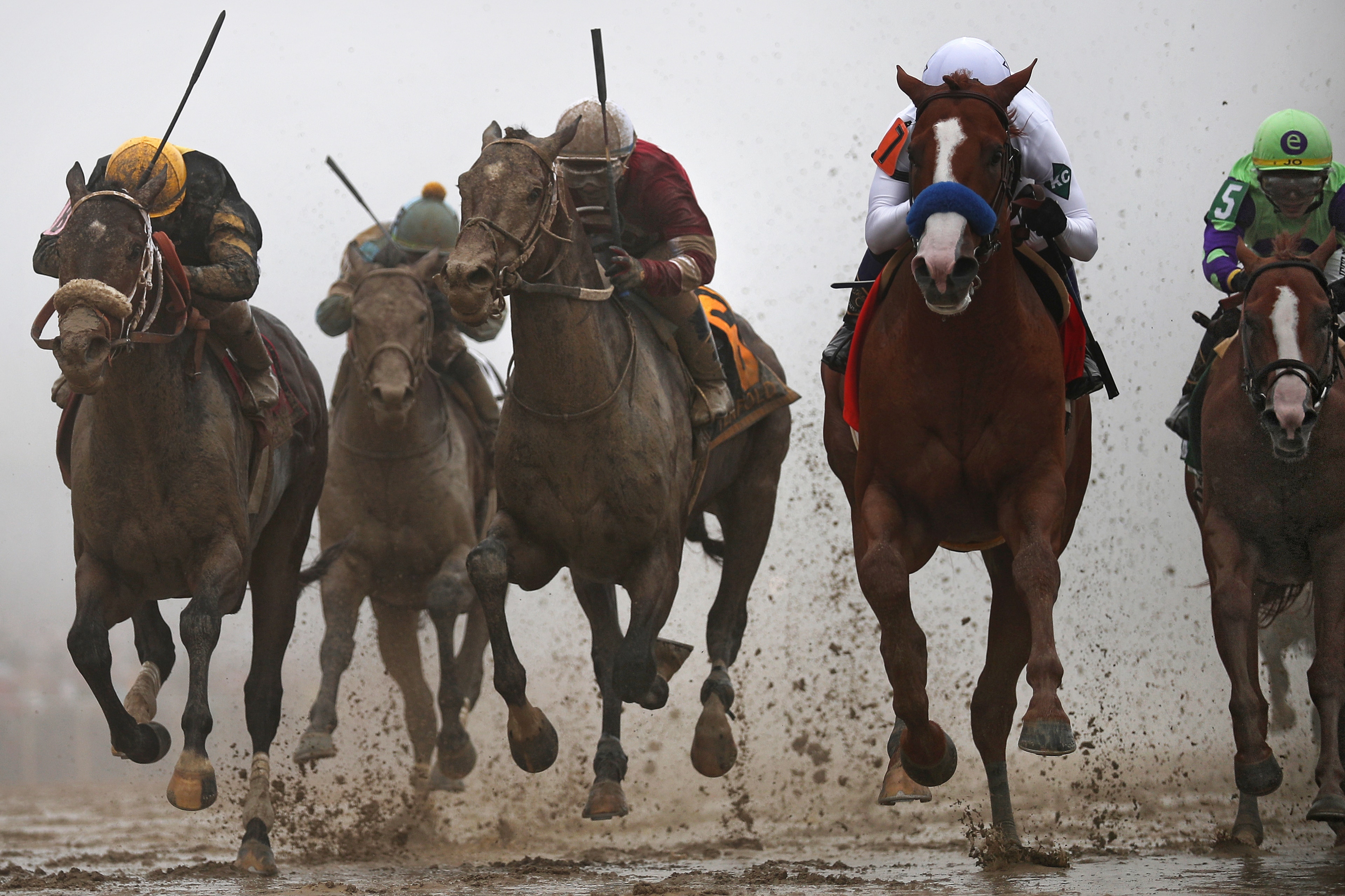 BALTIMORE, MD - MAY 19: Justify #7 ridden by jockey Mike Smith holds off Tenfold #6 ridden by jockey by Ricardo Santana Jr., and other horses to win the 143rd running of the Preakness Stakes at Pimlico Race Course on May 19, 2018 in Baltimore, Maryland. (Photo by Patrick Smith/Getty Images)