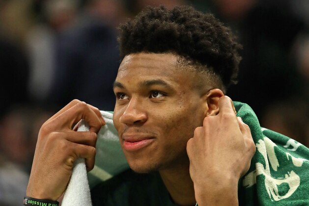 MILWAUKEE, WISCONSIN - MAY 08: Giannis Antetokounmpo #34 of the Milwaukee Bucks watches from the bench as teammates finish off the Boston Celtics at Fiserv Forum on May 08, 2019 in Milwaukee, Wisconsin. The Bucks defeated the Celtics 116-91. NOTE TO USER: User expressly acknowledges and agrees that, by downloading and or using this photograph, User is consenting to the terms and conditions of the Getty Images License Agreement. (Photo by Jonathan Daniel/Getty Images)