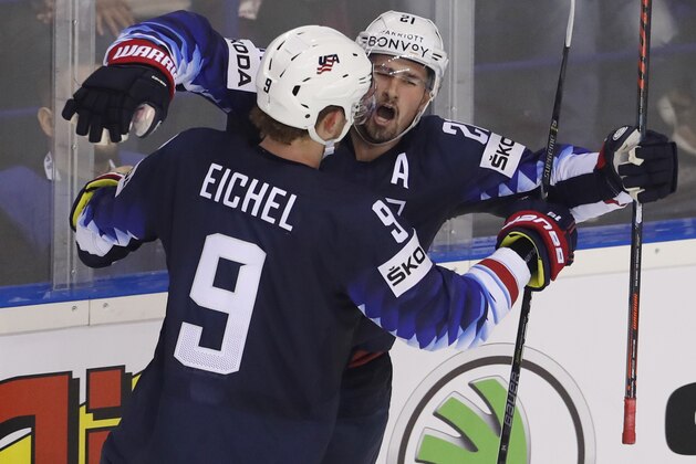 Dylan Larkin of the US, right, celebrates with Jack Eichel of the US, left, after scoring his sides winning goal during the Ice Hockey World Championships group A match between the United States and Finland at the Steel Arena in Kosice, Slovakia, Monday, May 13, 2019. (AP Photo/Petr David Josek)