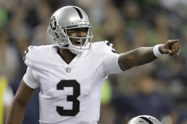 Oakland Raiders quarterback EJ Manuel gestures from the line of scrimmage during the first half of an NFL football preseason game against the Seattle Seahawks, Thursday, Aug. 30, 2018, in Seattle. (AP Photo/Stephen Brashear)