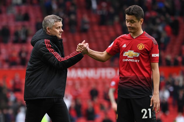 Manchester United's Norwegian manager Ole Gunnar Solskjaer (L) shakes hands with Manchester United's Spanish midfielder Ander Herrera (R) at the end of the English Premier League football match between Manchester United and Chelsea at Old Trafford in Manchester, north west England, on April 28, 2019. (Photo by Paul ELLIS / AFP) / RESTRICTED TO EDITORIAL USE. No use with unauthorized audio, video, data, fixture lists, club/league logos or 'live' services. Online in-match use limited to 120 images. An additional 40 images may be used in extra time. No video emulation. Social media in-match use limited to 120 images. An additional 40 images may be used in extra time. No use in betting publications, games or single club/league/player publications. /         (Photo credit should read PAUL ELLIS/AFP/Getty Images)
