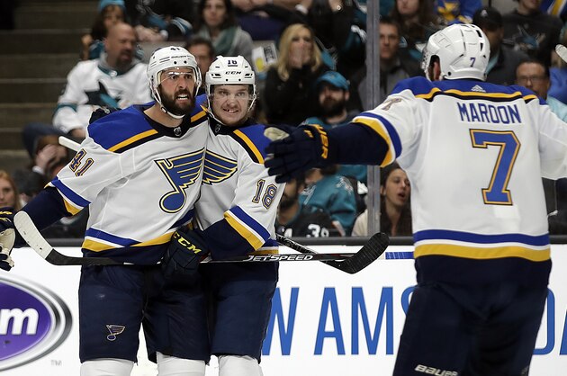 St. Louis Blues' Robert Bortuzzo, left, celebrates with teammates Robert Thomas (18) and Pat Maroon (7) after scoring a goal against the San Jose Sharks in the second period in Game 2 of the NHL hockey Stanley Cup Western Conference finals Monday, May 13, 2019, in San Jose, Calif. (AP Photo/Ben Margot)
