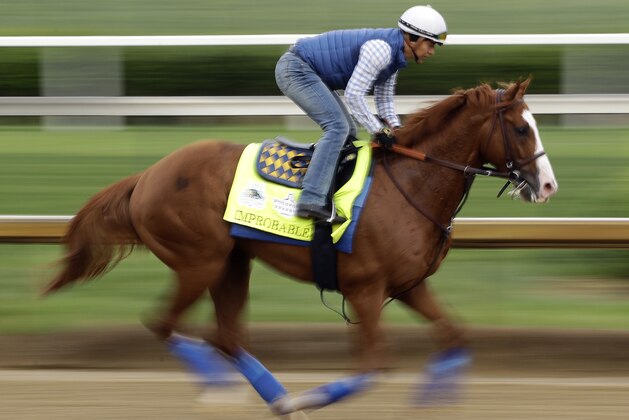Kentucky Derby entrant Improbable runs during a workout at Churchill Downs Thursday, May 2, 2019, in Louisville, Ky. The 145th running of the Kentucky Derby is scheduled for Saturday, May 4. (AP Photo/Charlie Riedel)