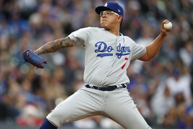 Los Angeles Dodgers starting pitcher Julio Urias works against the Colorado Rockies during the first inning of a baseball game Sunday, April 7, 2019, in Denver. (AP Photo/David Zalubowski)