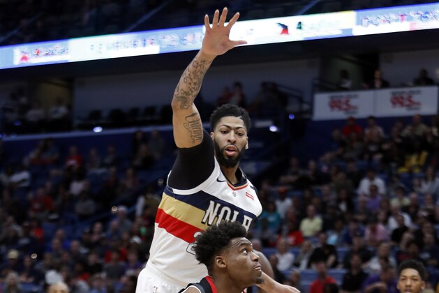 Houston Rockets forward Danuel House Jr. (4) is guarded by New Orleans Pelicans forward Anthony Davis (23) during the first half of an NBA basketball game in New Orleans, Sunday, March 24, 2019. (AP Photo/Tyler Kaufman)
