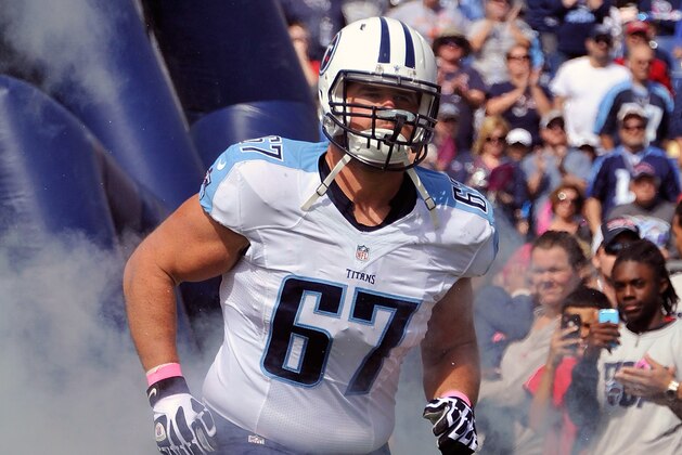 NASHVILLE, TN - OCTOBER 05:  Andy Levitre #67 of the Tennessee Titans runs onto the field prior to a game against the Cleveland Browns at LP Field on October 5, 2014 in Nashville, Tennessee.  (Photo by Frederick Breedon/Getty Images)