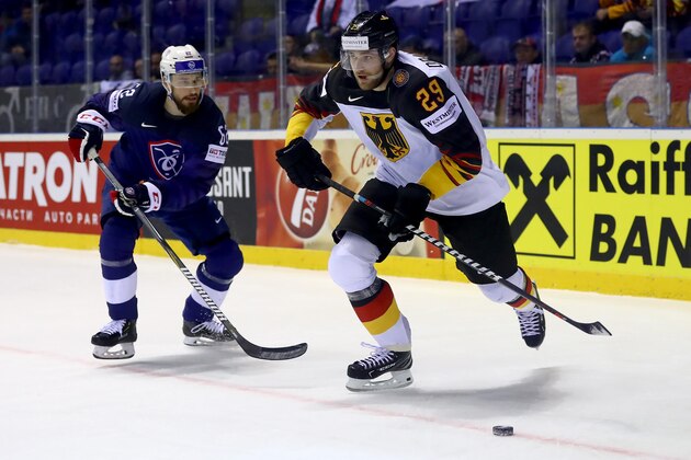 KOSICE, SLOVAKIA - MAY 14: Leon Draisaitl #29 of Germany challenges  Florian Chakiachvili #62 of France during the 2019 IIHF Ice Hockey World Championship Slovakia group A game between Germany and France at Steel Arena on May 14, 2019 in Kosice, Slovakia. (Photo by Martin Rose/Getty Images)