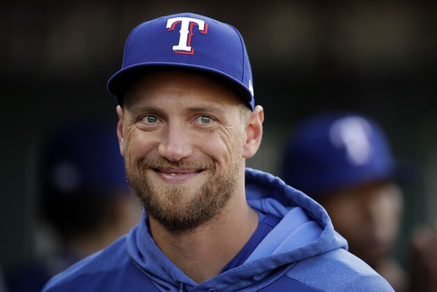 Texas Rangers' Hunter Pence smiles in the dugout prior to the baseball game against the Oakland Athletics Monday, April 22, 2019, in Oakland, Calif. (AP Photo/Ben Margot)