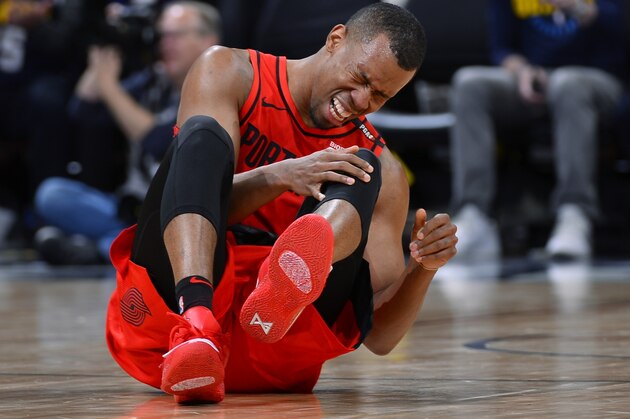 Portland Trail Blazers guard Rodney Hood reacts after being injured in the second half of Game 7 of an NBA basketball second-round playoff series against the Denver Nuggets Sunday, May 12, 2019, in Denver. (AP Photo/John Leyba)