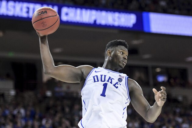 Duke forward Zion Williamson (1) grabs a rebound against Central Florida during the second half of a second-round game in the NCAA men's college basketball tournament Sunday, March 24, 2019, in Columbia, S.C. Duke defeated Central Florida 77-76. (AP Photo/Sean Rayford)