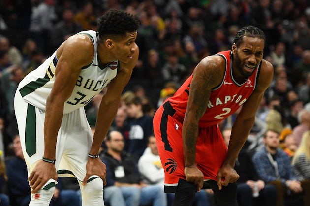 MILWAUKEE, WISCONSIN - JANUARY 05:  Giannis Antetokounmpo #34 of the Milwaukee Bucks and Kawhi Leonard #2 of the Toronto Raptors wait for a free throw during a game at Fiserv Forum on January 05, 2019 in Milwaukee, Wisconsin.  NOTE TO USER: User expressly acknowledges and agrees that, by downloading and or using this photograph, User is consenting to the terms and conditions of the Getty Images License Agreement. (Photo by Stacy Revere/Getty Images)