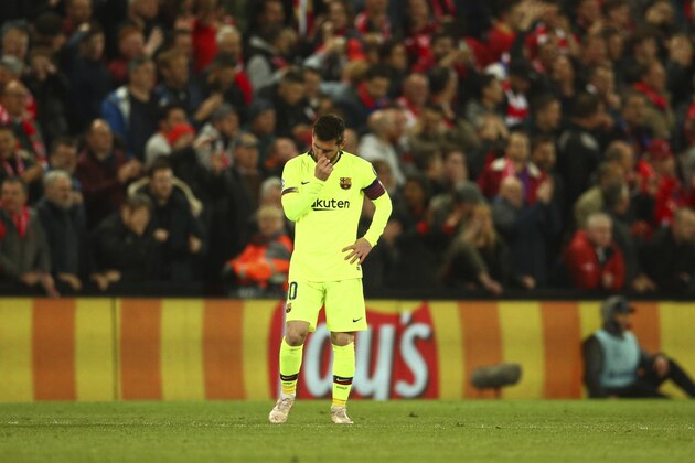 Barcelona's Lionel Messi reasts as Liverpool's Georginio Wijnaldum celebrates with teammates scoring his side's 2nd goal during the Champions League semifinal, second leg, soccer match between Liverpool and FC Barcelona at the Anfield stadium in Liverpool, England, Tuesday, May 7, 2019. (AP Photo/Dave Thompson)