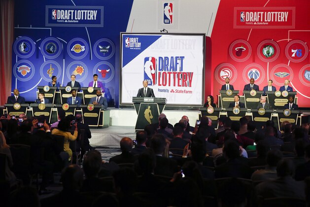 NBA Deputy Commissioner Mark Tatum gets ready to announce the order of the picks during the NBA basketball draft lottery Tuesday, May 14, 2019, in Chicago. (AP Photo/Nuccio DiNuzzo)