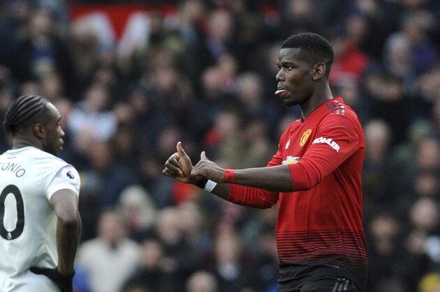 Manchester United's Paul Pogba gestures after scoring his side's second goal during the English Premier League soccer match between Manchester United and West Ham United at Old Trafford in Manchester, England, Saturday, April 13, 2019. (AP Photo/Rui Vieira)